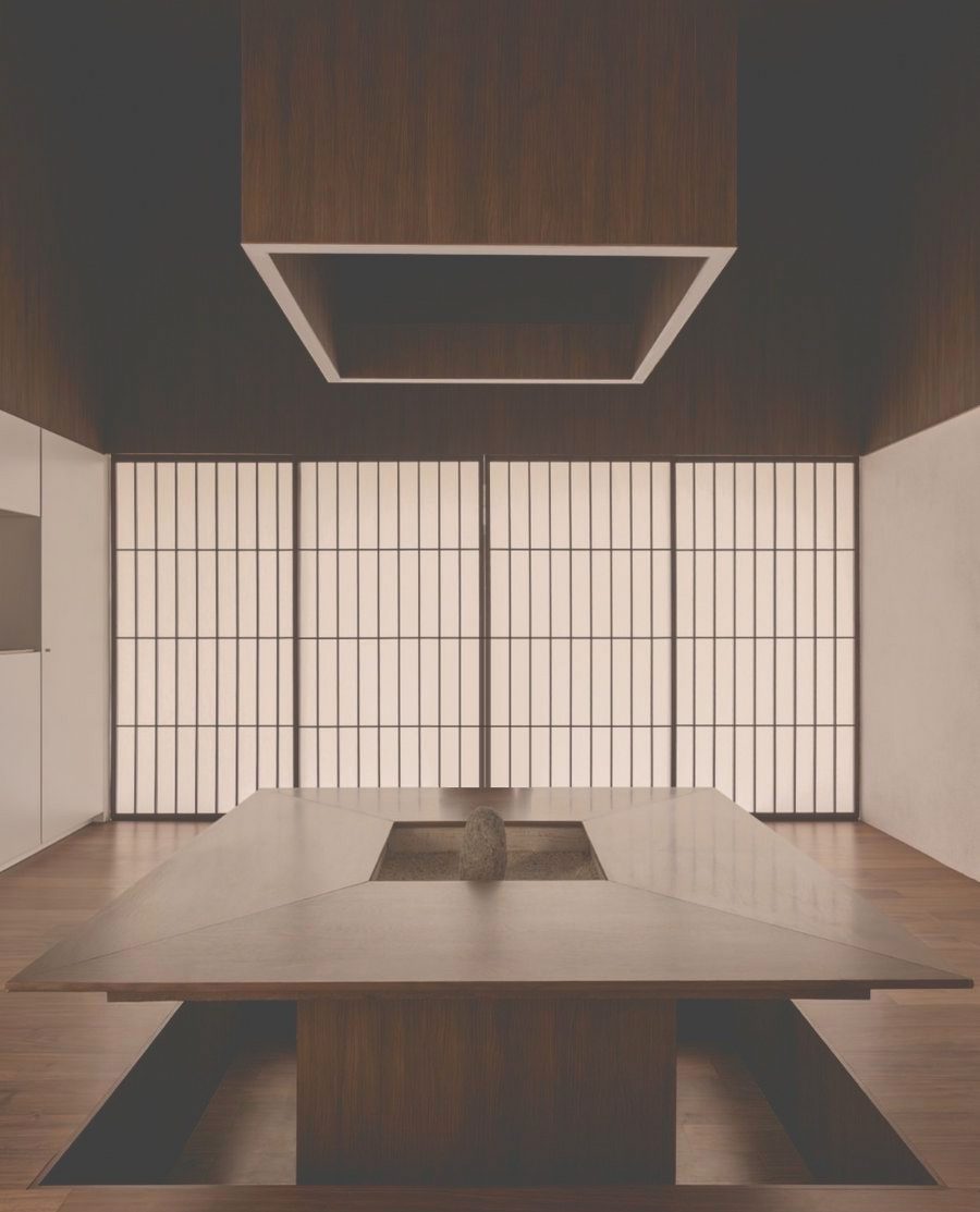 A quiet tea room of dark timber, paper screens and a low sunken table